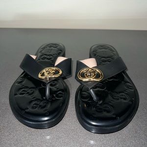Gucci GG black leather sandals.
